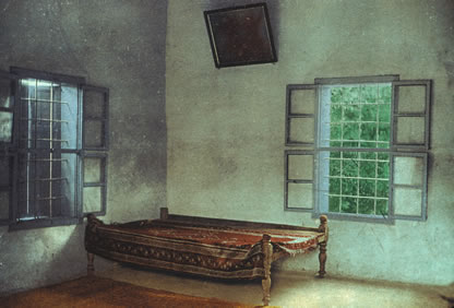 Colorized photograph of the interior of the house where Bahá’u’lláh often spent the night when visiting the Ridván Garden.