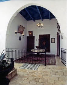 The interior of the house of ‘Údí Khammár. The entrance to the room of Bahá’u’lláh is on the right.