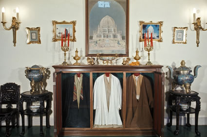 Three of the robes worn by Bahá’u’lláh displayed in the Bahá'í International Archives.