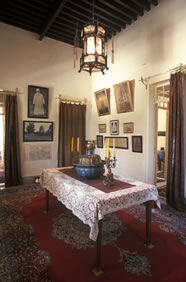 The anteroom just outside the room of Bahá’u’lláh in the Mansion of Mazra‘ih. His room is located on the far left.