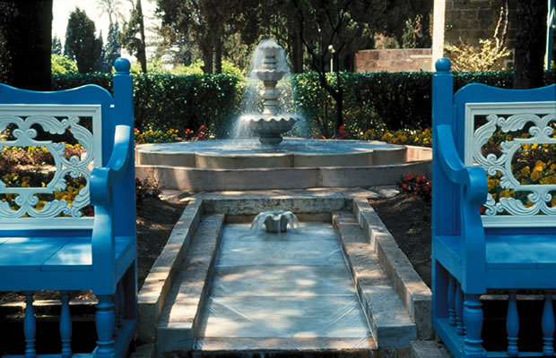 Recent view of the fountain and benches in the Ridván Garden.