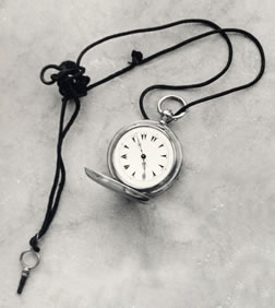 Pocket watch, watch cord and fob belonging to Bahá’u’lláh.